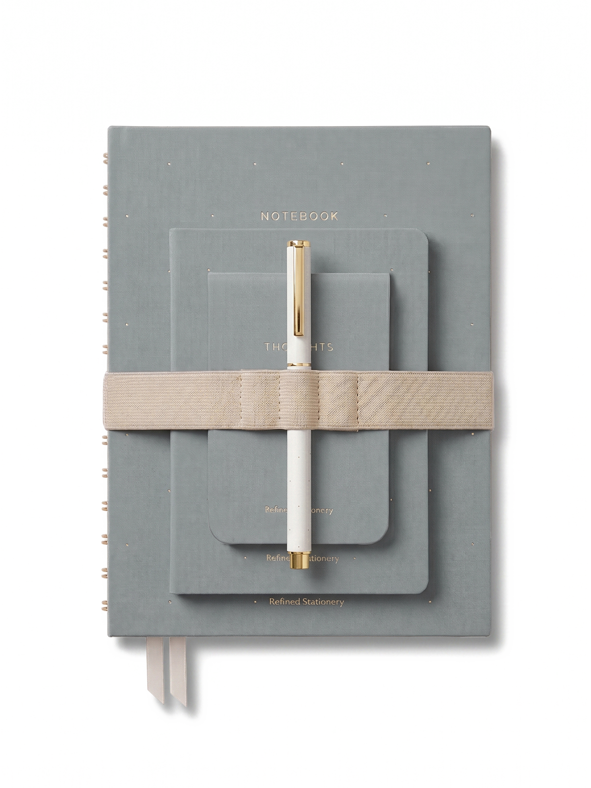 conjunto de cuadernos entelados en color azul con goma de cierre y boli de gel